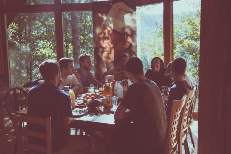 a group of people eating in a restaurant