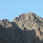 a mountain with a blue sky