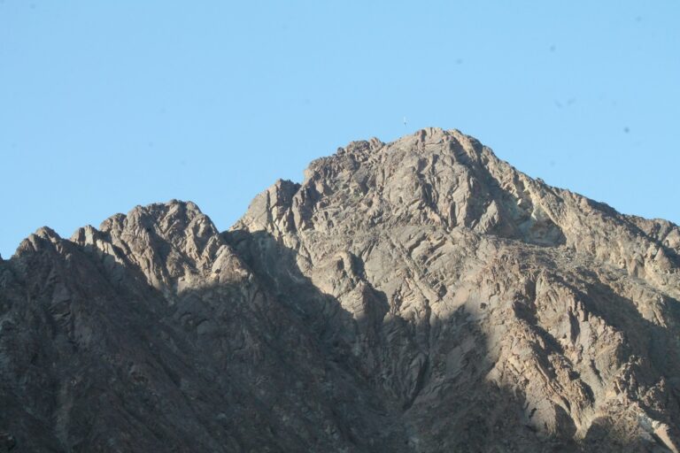 a mountain with a blue sky
