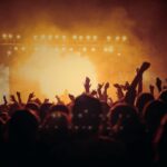 band performing on stage in front of people